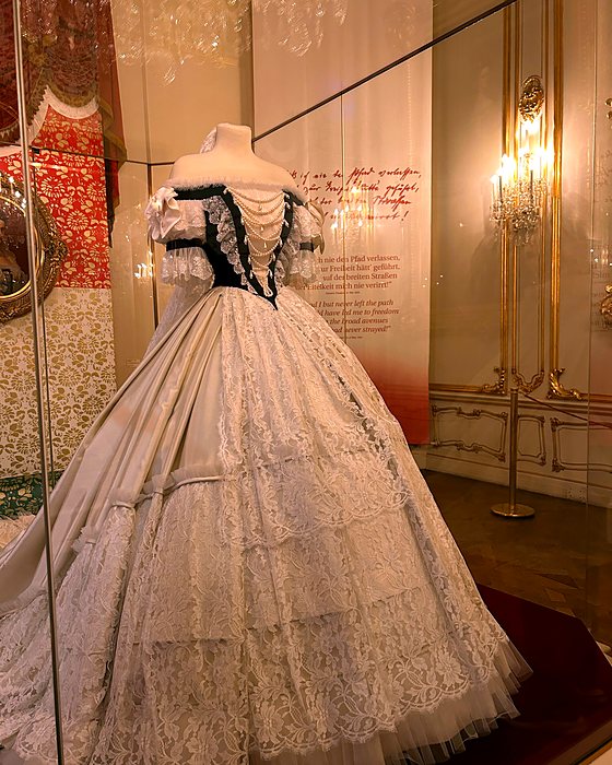A nineteenth-century crinoline evening gown on display in the Sisi Museum