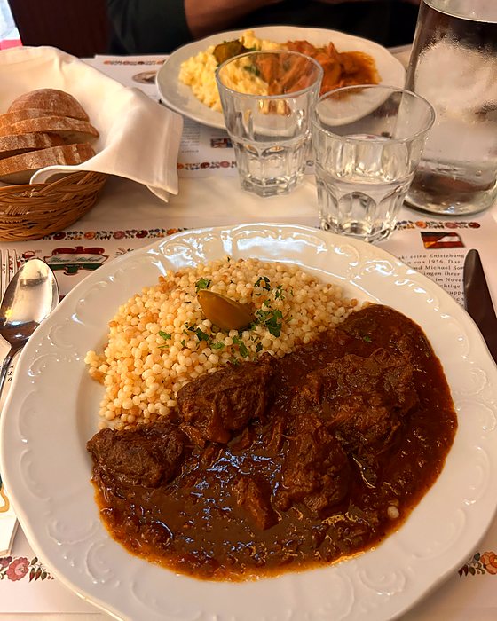 A plate of goulash with a side