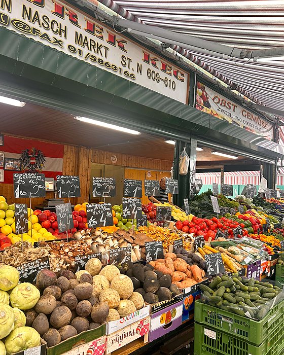 A stall of colourful fruit and vegetables at the Naschmarkt