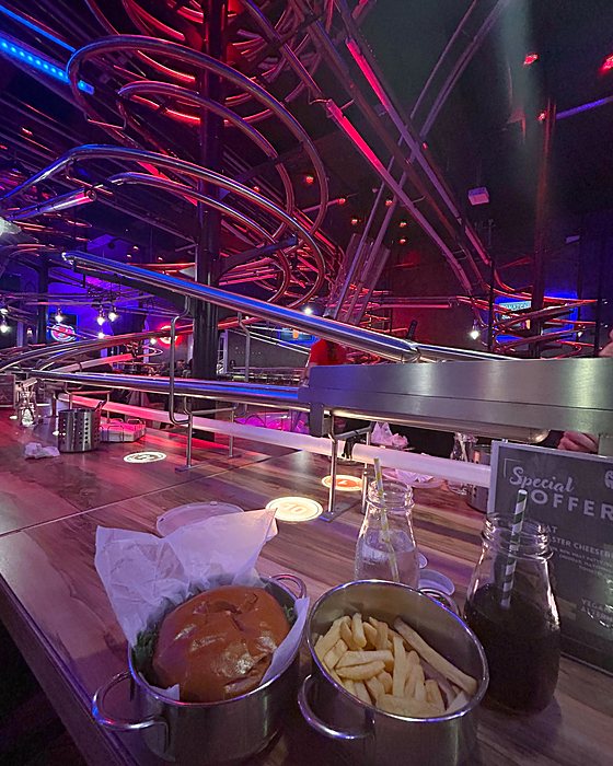 The Rollercoaster Restaurant with neon-lit rails